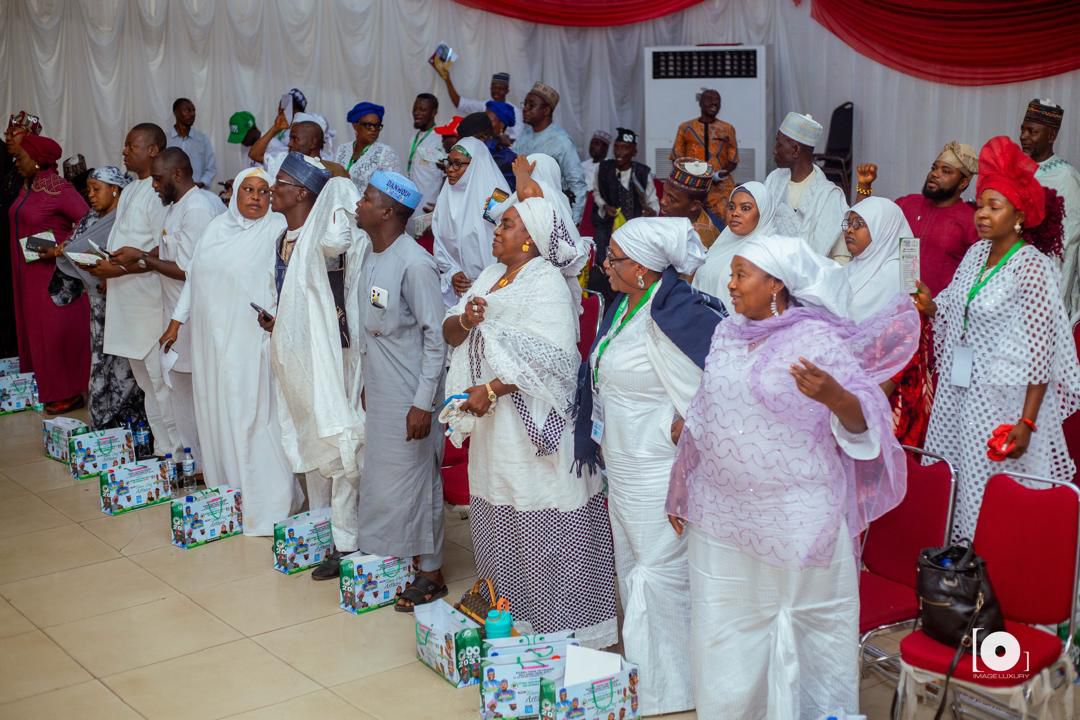 Members of NPSGGG standing in prayer at a chapter gathering